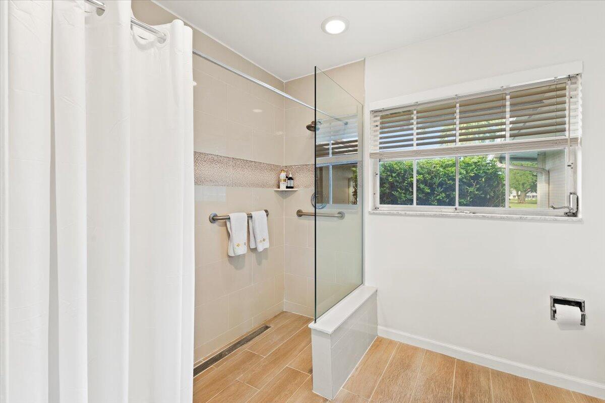 233 Rio Vista Circle, Unit 233 Atlantis, FL 33462 - Photo 16 of 33 a view of empty room with wooden floor and fan