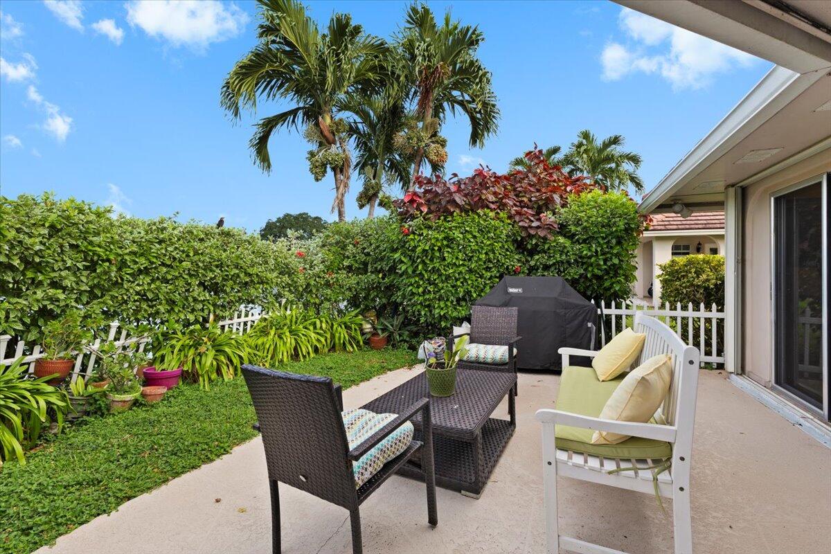 233 Rio Vista Circle, Unit 233 Atlantis, FL 33462 - Photo 22 of 33 a house view with a garden space