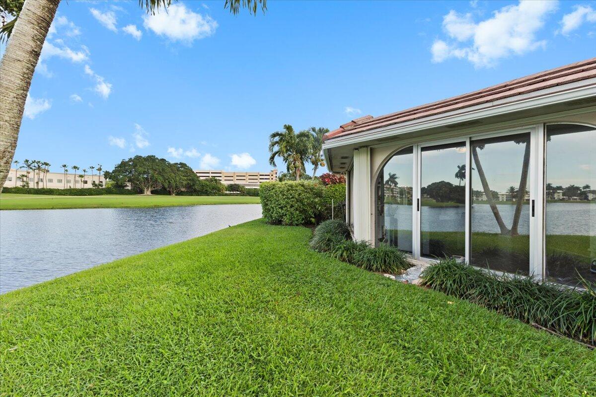 233 Rio Vista Circle, Unit 233 Atlantis, FL 33462 - Photo 25 of 33 a view of a garden with a lake view