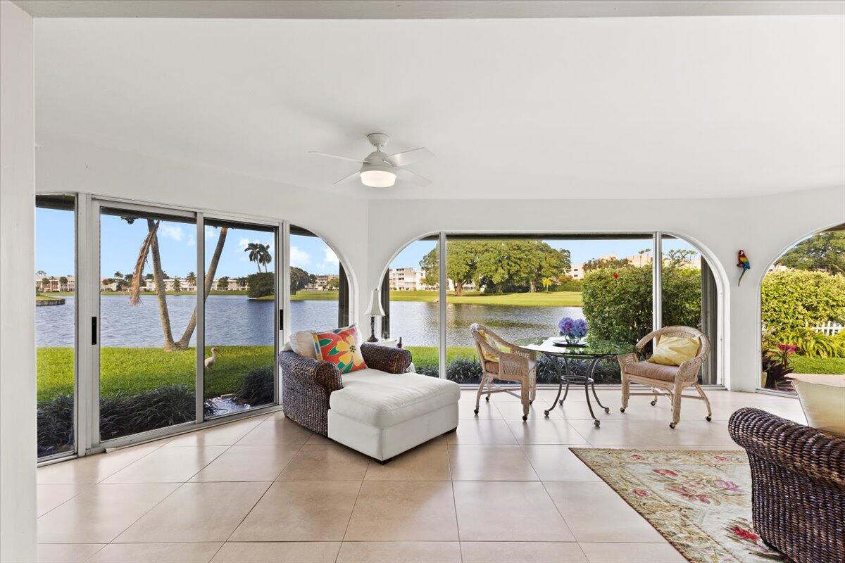 233 Rio Vista Circle, Unit 233 Atlantis, FL 33462 - Photo 5 of 33 a living room with furniture and a floor to ceiling window