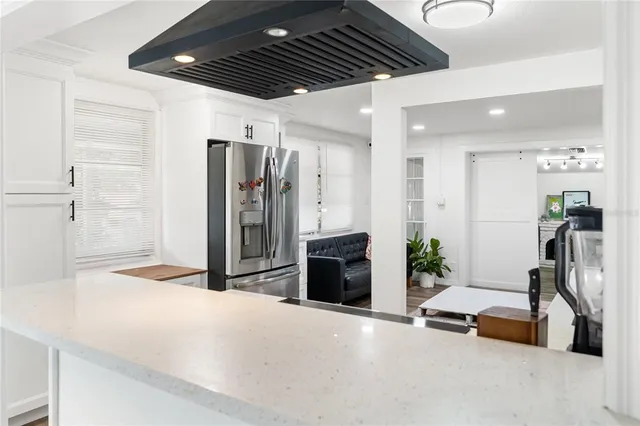 a livingroom with furniture and a chandelier