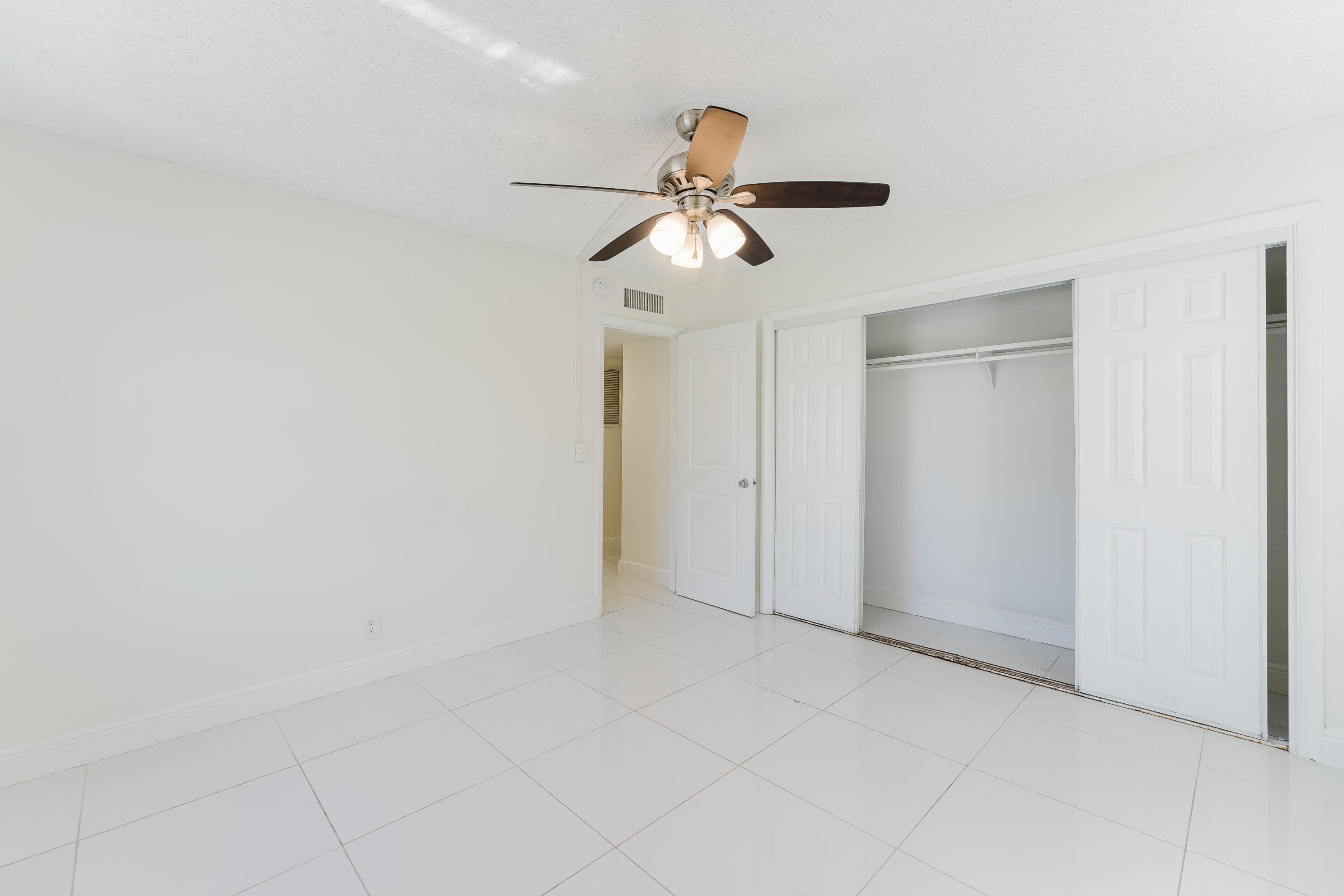 606 Northwest 13th Street, Unit 23 Boca Raton, FL 33486 - Photo 18 of 37 a view of an empty room