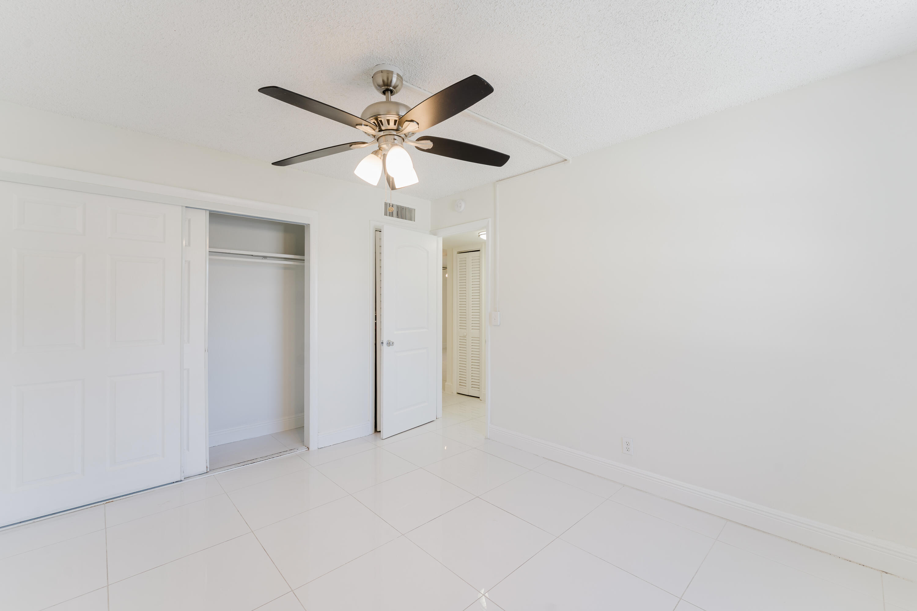606 Northwest 13th Street, Unit 23 Boca Raton, FL 33486 - Photo 21 of 37 a view of an empty room