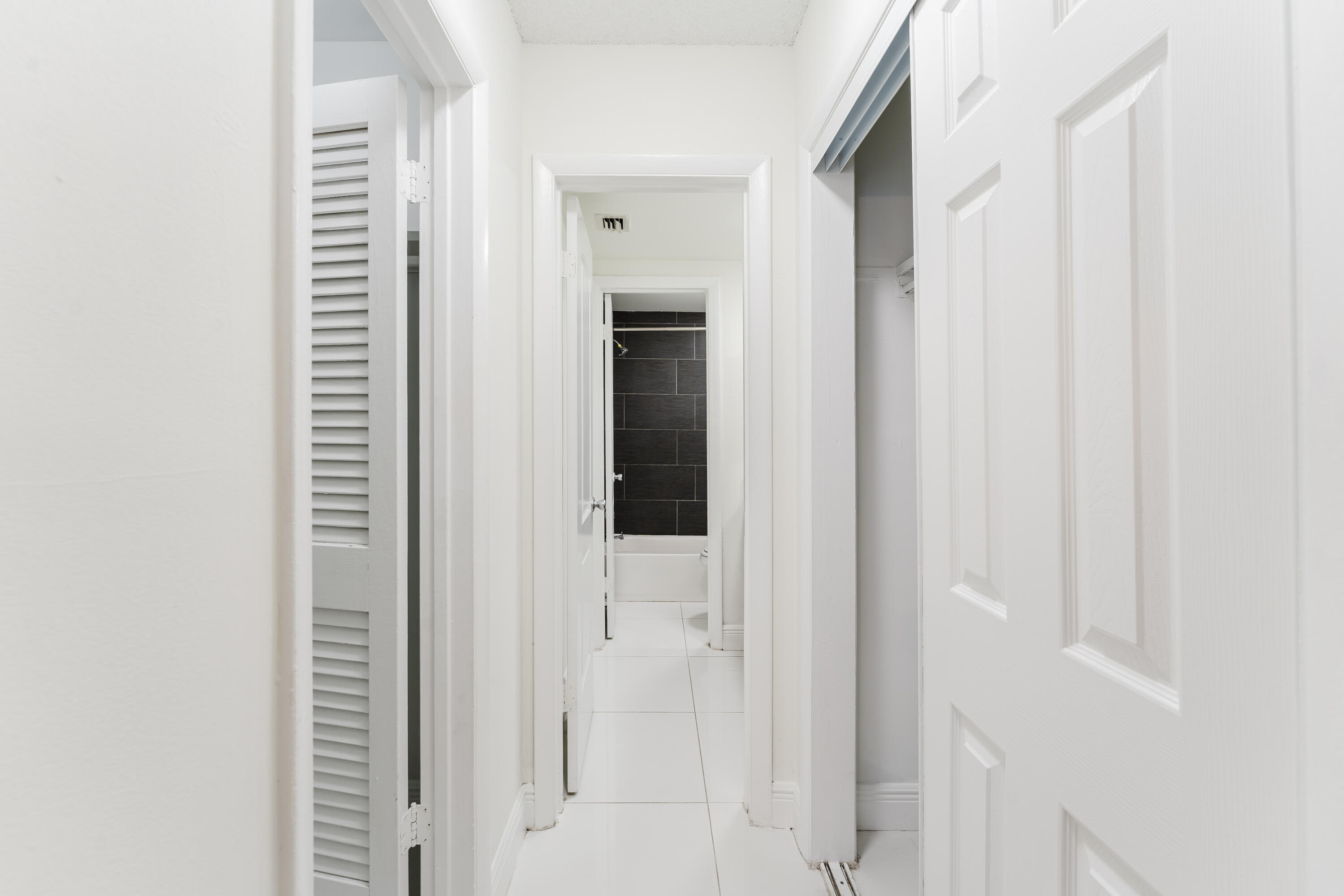 606 Northwest 13th Street, Unit 23 Boca Raton, FL 33486 - Photo 26 of 37 a view of a bathroom with a shower