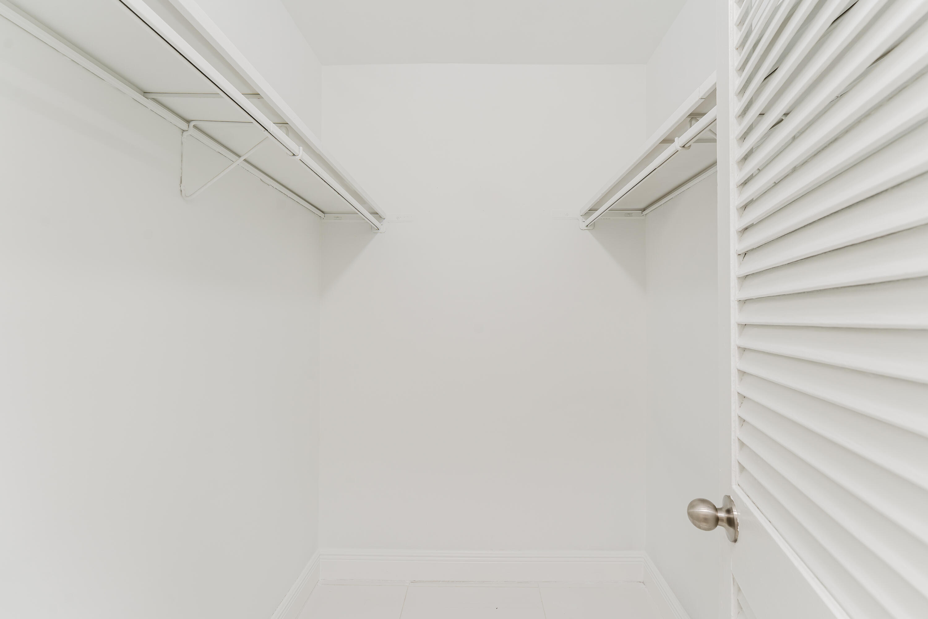 606 Northwest 13th Street, Unit 23 Boca Raton, FL 33486 - Photo 27 of 37 a view of small space with racks on the wall