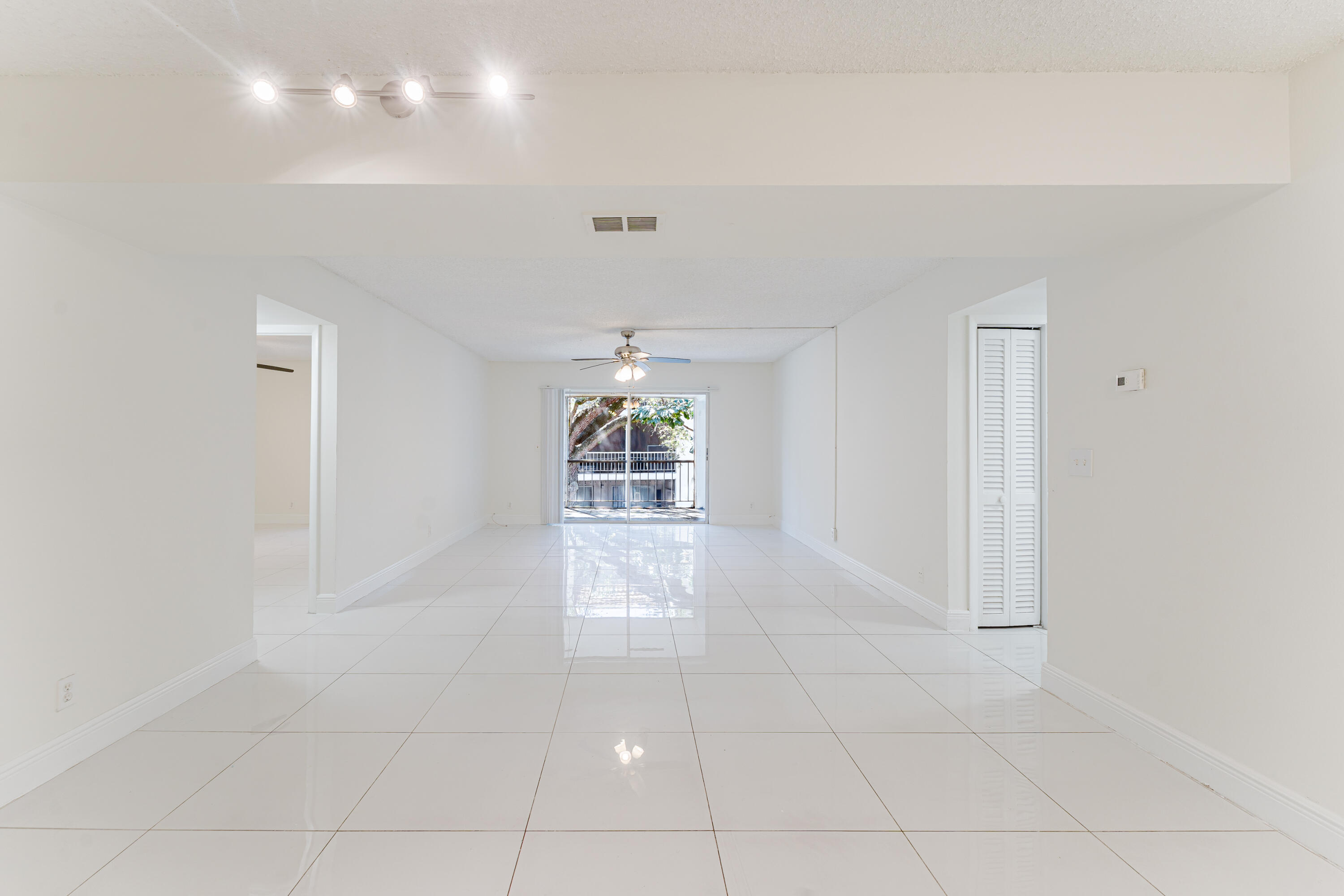 606 Northwest 13th Street, Unit 23 Boca Raton, FL 33486 - Photo 5 of 37 a view of an empty room with a window