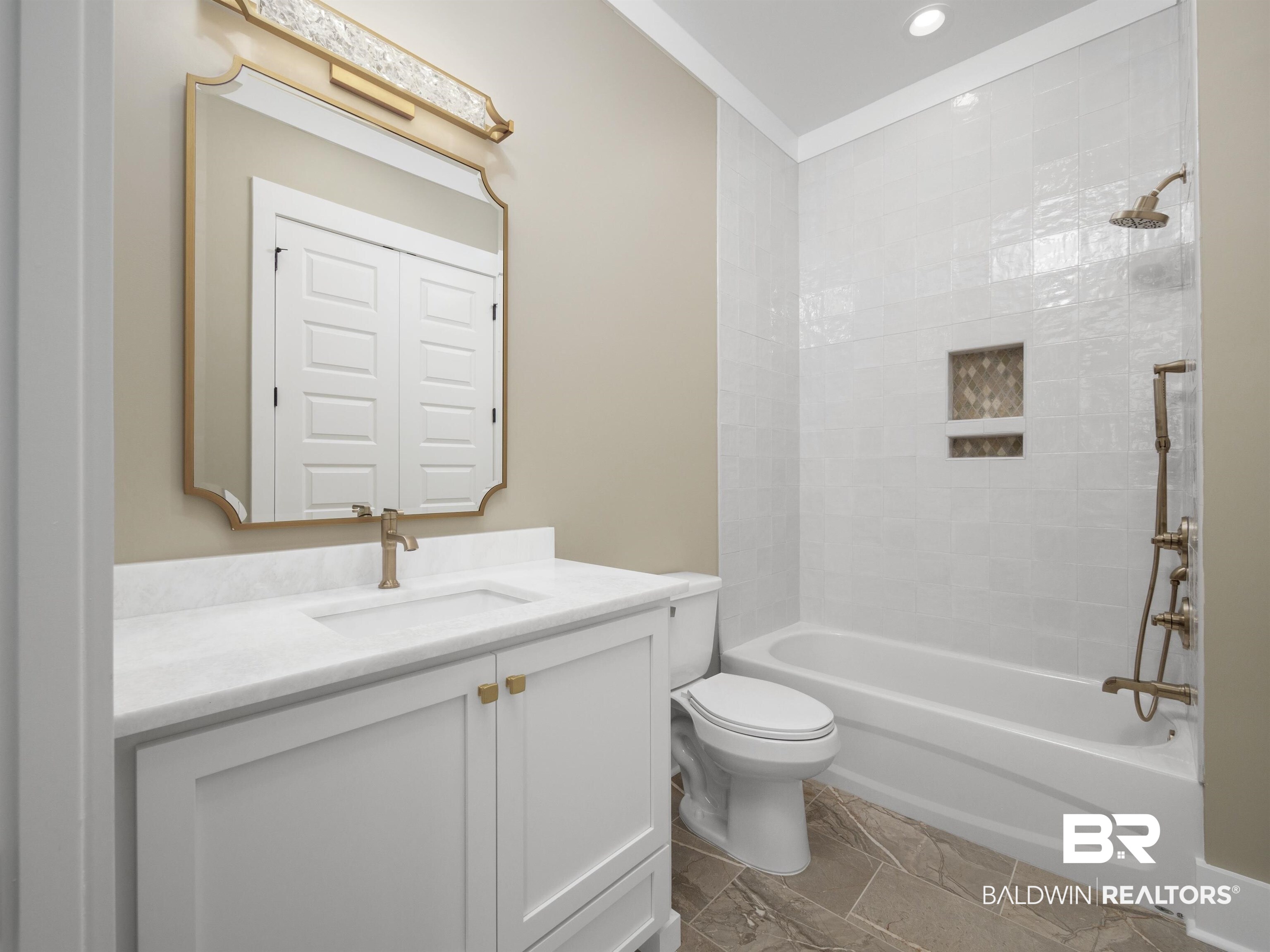 10970 Turin Avenue Fairhope, AL 36532 - Photo 29 of 61 Private bath with quartz counters, custom cabinets, shower tub combo, walk in closet with built in dresser