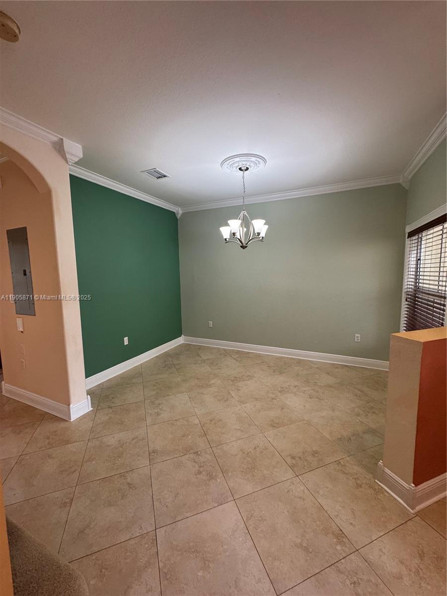3166 Merrick Terrace, Unit 1705 Margate, FL 33063 - Photo 11 of 41 a view of an empty room with a window