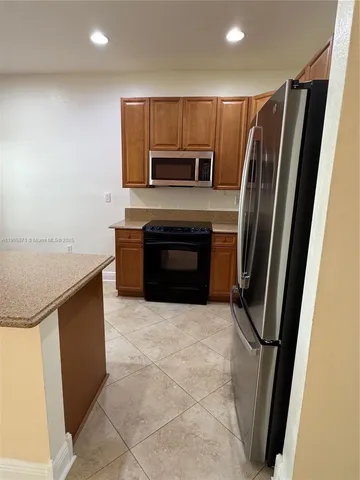 a room with a sink a window and a table