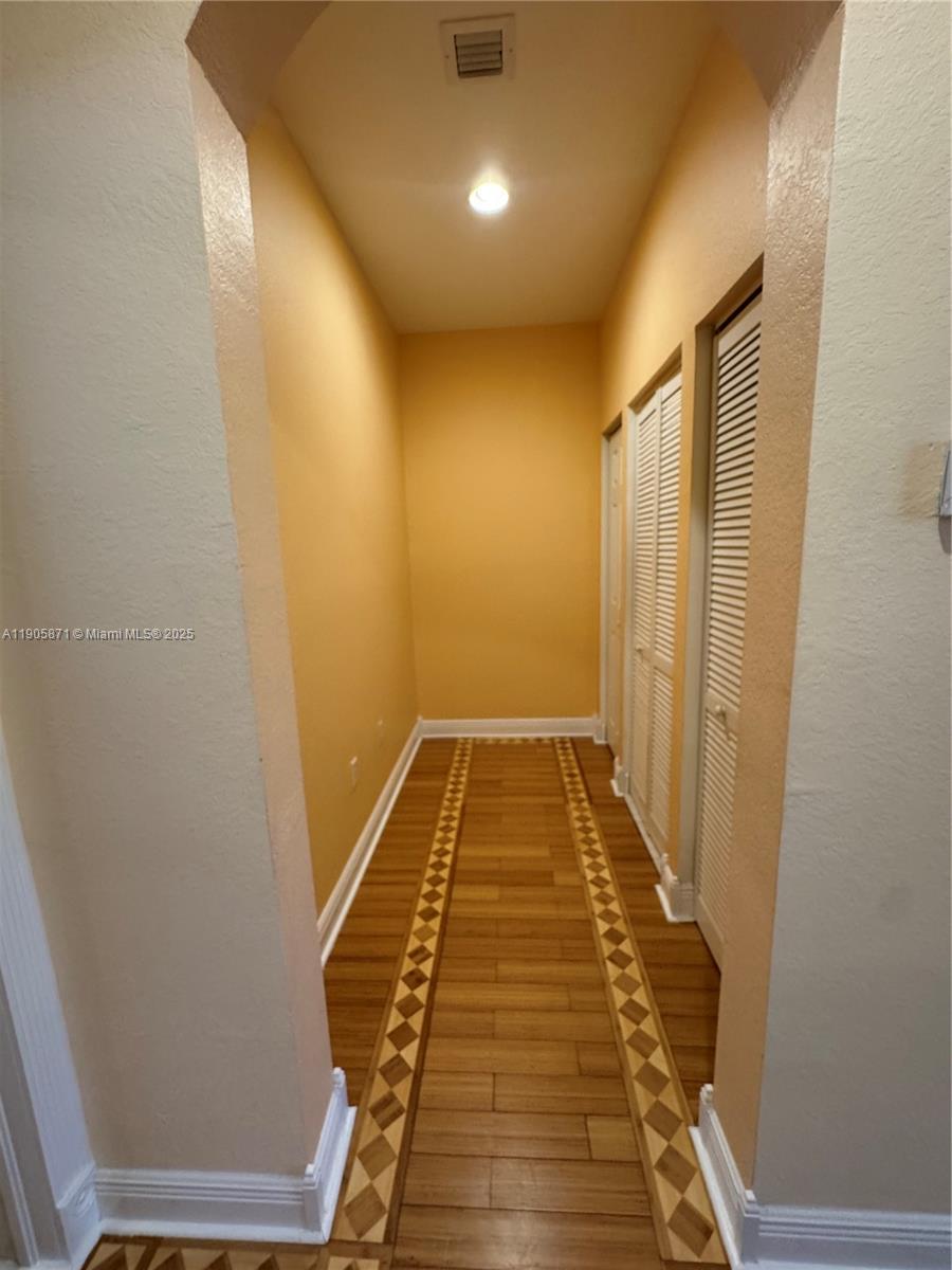 3166 Merrick Terrace, Unit 1705 Margate, FL 33063 - Photo 28 of 41 a view of wooden floor