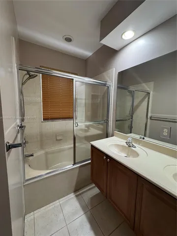 a view of a bathroom with wooden floor