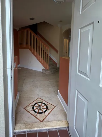 a view of room with furniture and windows