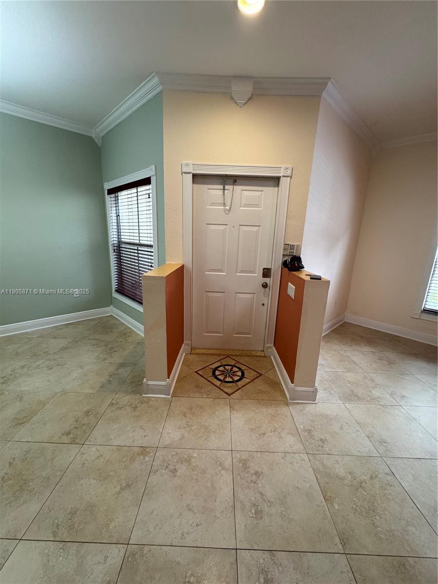 3166 Merrick Terrace, Unit 1705 Margate, FL 33063 - Photo 8 of 41 a view of room with furniture and windows