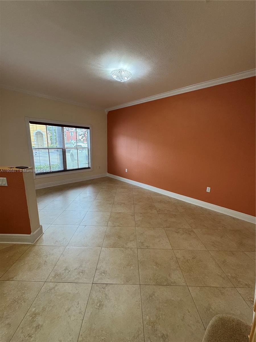 3166 Merrick Terrace, Unit 1705 Margate, FL 33063 - Photo 9 of 41 an empty room with windows