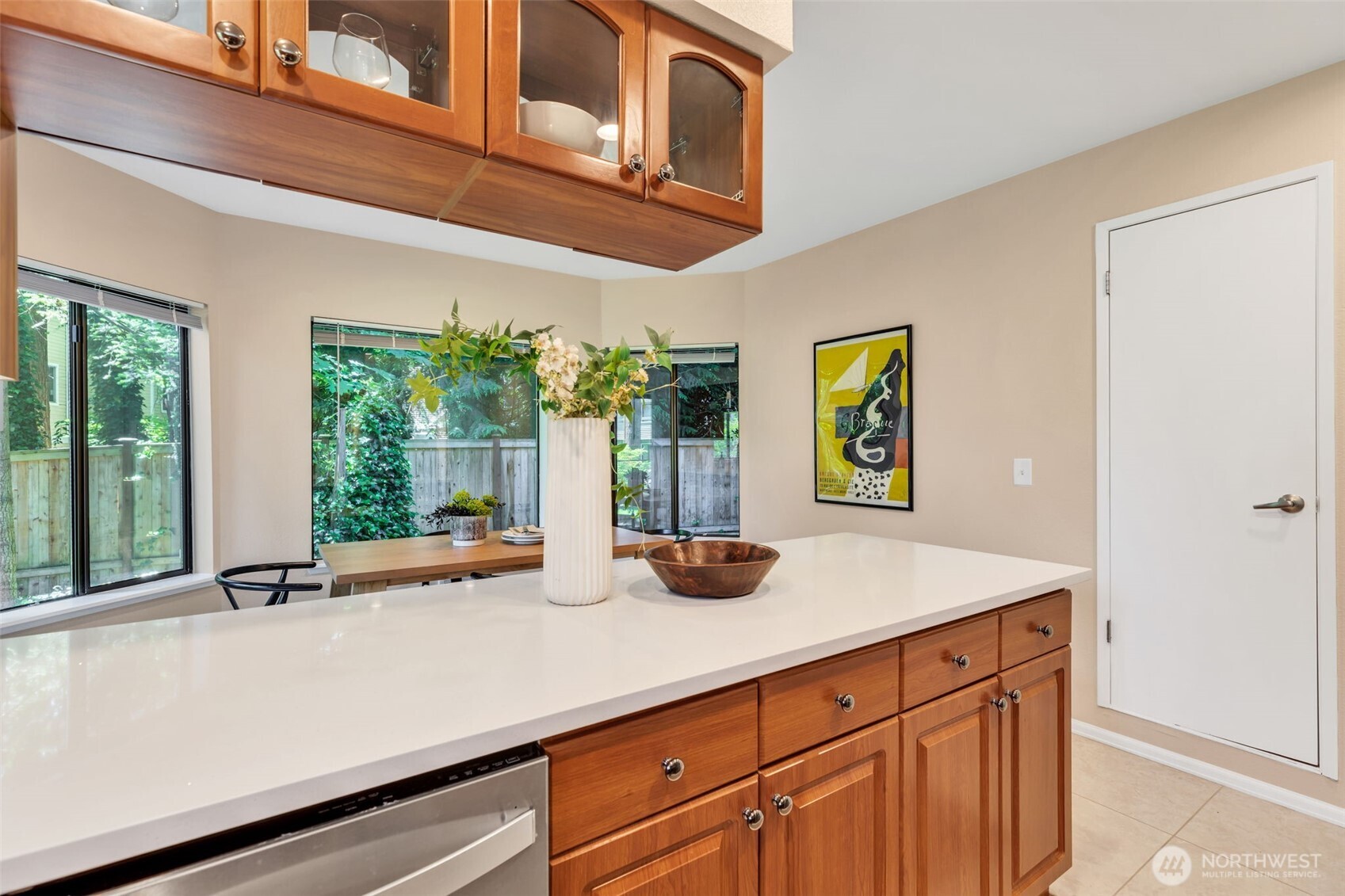 9009 Avondale Road Northeast, Unit D107 Redmond, WA 98052 - Photo 11 of 34 a kitchen with a sink and large window