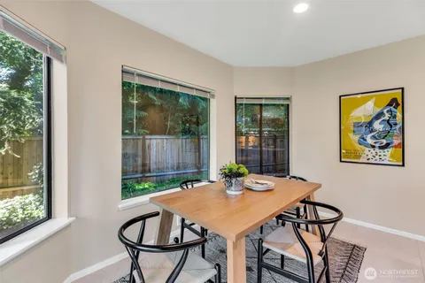 a view of a dining room with furniture window and outside view