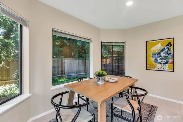 a view of a dining room with furniture window and outside view