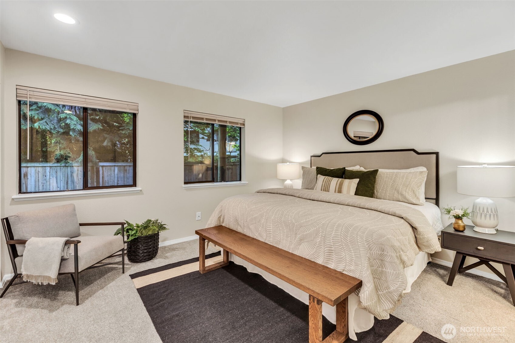 9009 Avondale Road Northeast, Unit D107 Redmond, WA 98052 - Photo 16 of 34 a bedroom with a bed and windows