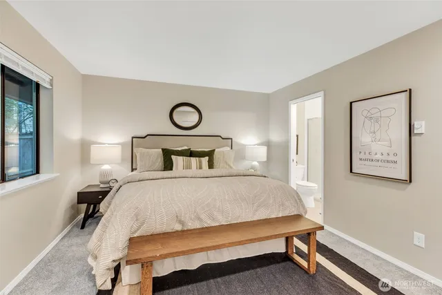 a bedroom with a bed and window