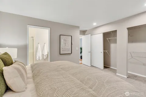 a large white bed in a white room