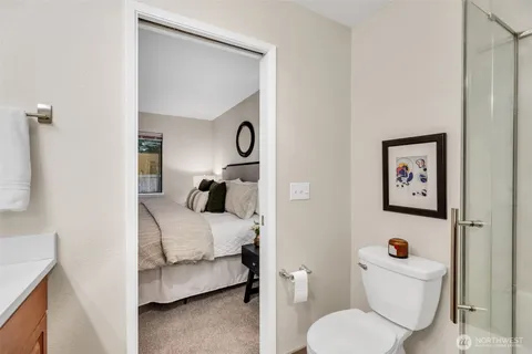 a bedroom with a bed and a couch