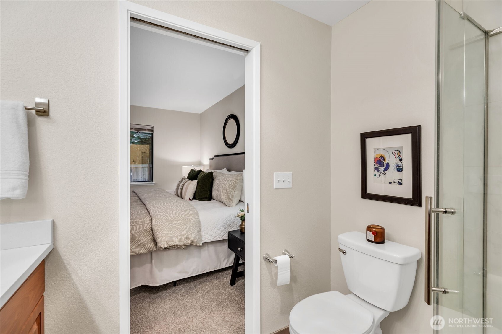 9009 Avondale Road Northeast, Unit D107 Redmond, WA 98052 - Photo 21 of 34 a bedroom with a bed and a couch