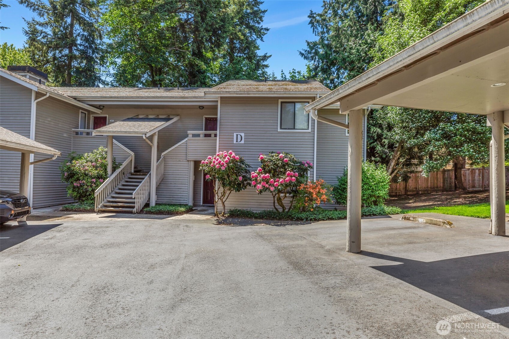 9009 Avondale Road Northeast, Unit D107 Redmond, WA 98052 - Photo 28 of 34 a view of a house with a porch and furniture