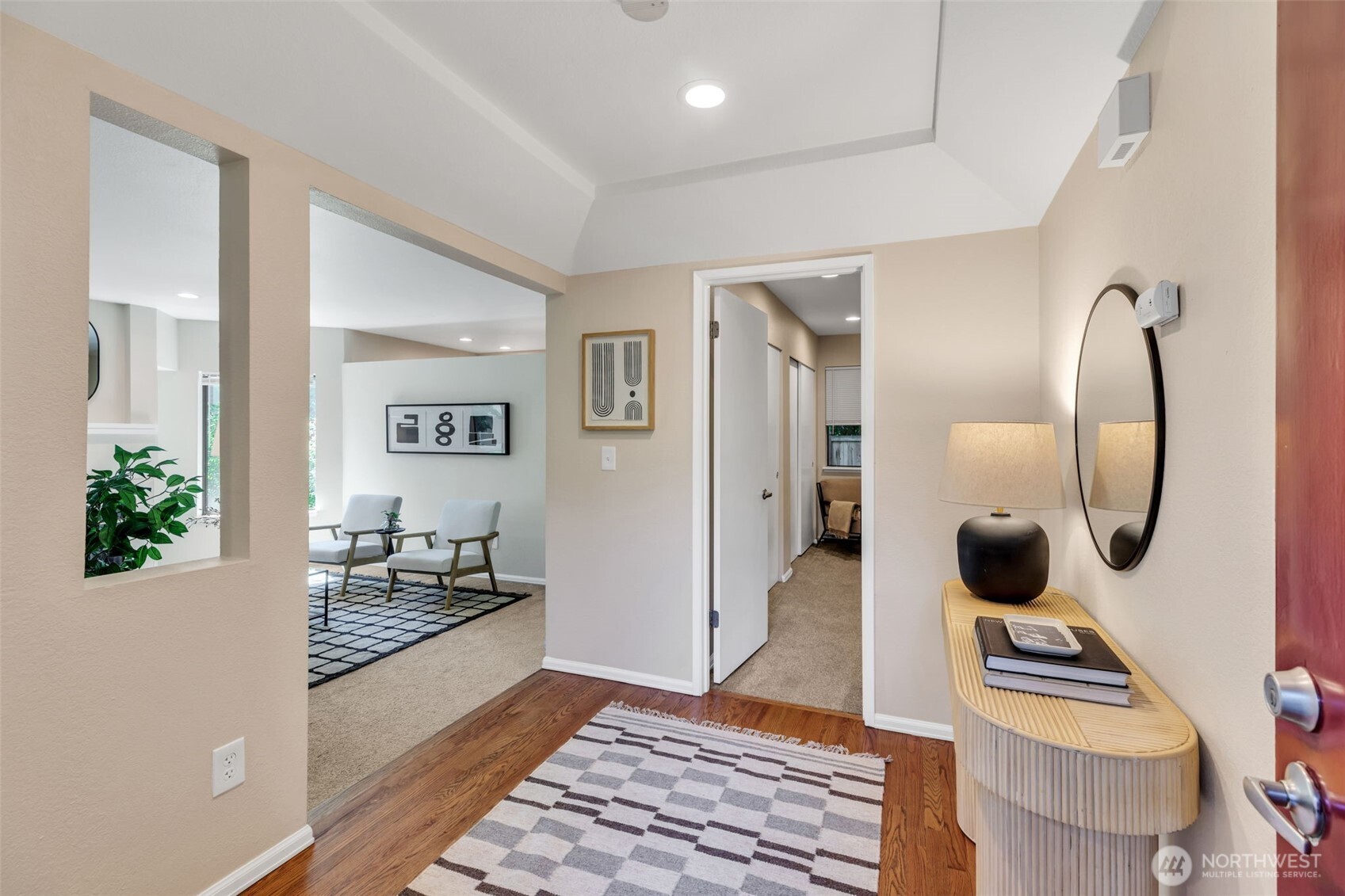 9009 Avondale Road Northeast, Unit D107 Redmond, WA 98052 - Photo 3 of 34 a living room with furniture and wooden floor