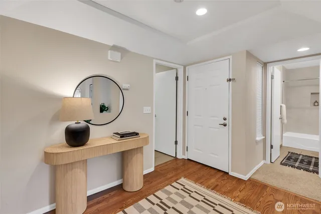 a bedroom with a bed and a mirror