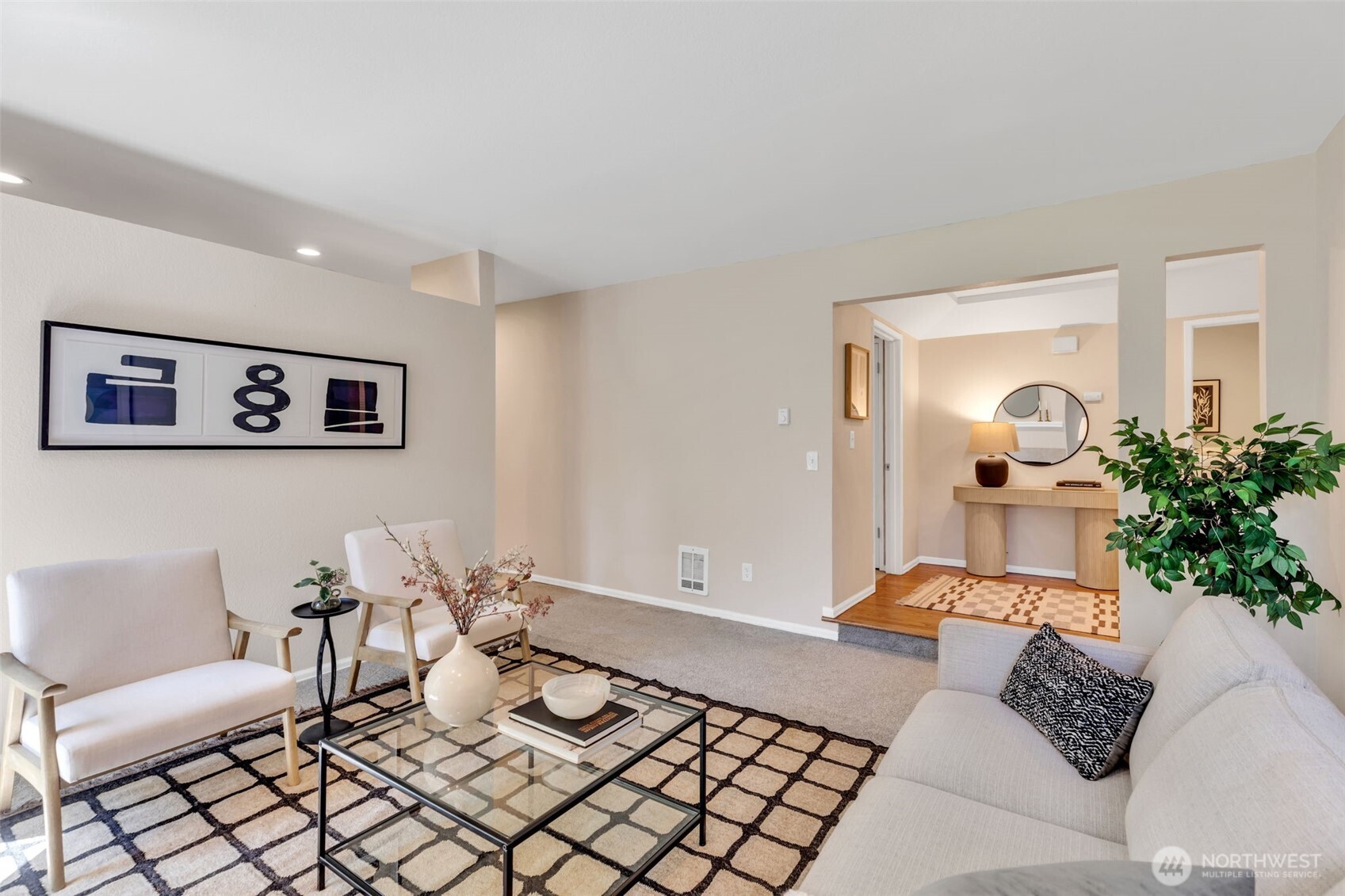9009 Avondale Road Northeast, Unit D107 Redmond, WA 98052 - Photo 7 of 34 a living room with furniture and flowers