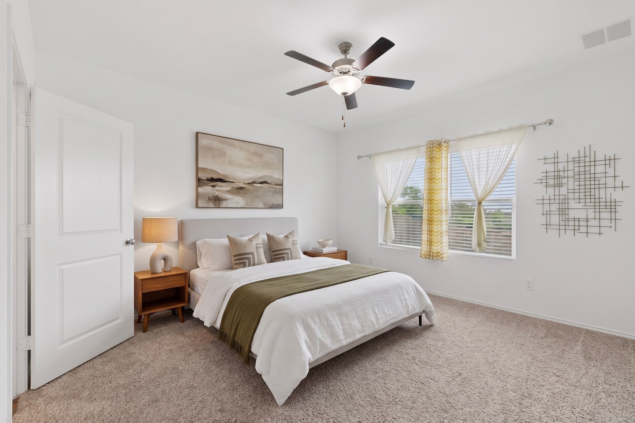936 Mallow Road Leander, TX 78641 - Photo 9 of 16 Carpeted bedroom featuring a ceiling fan with integrated lighting, a window with horizontal blinds, and a white paneled door