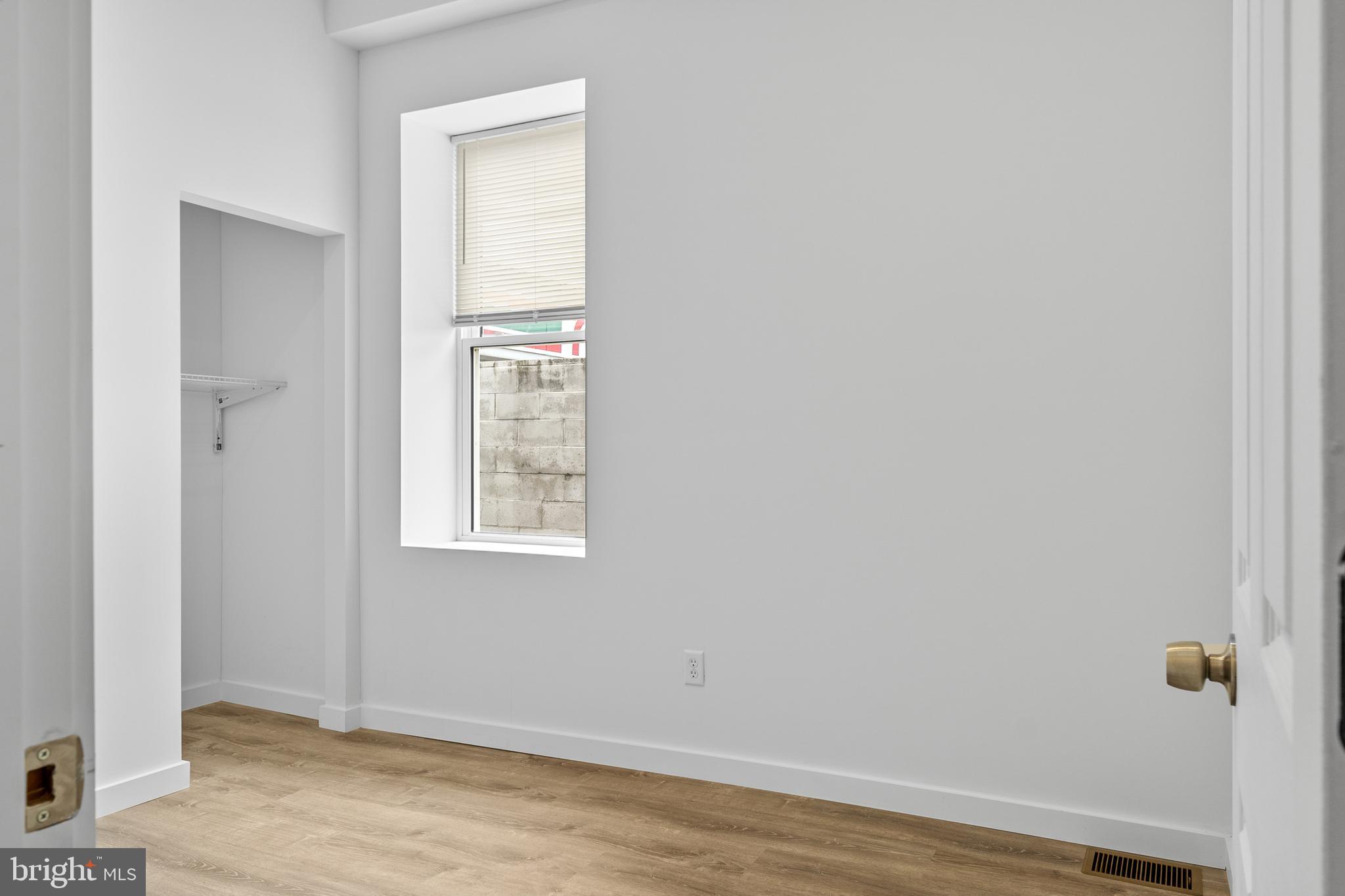 2652 Bridge Street Philadelphia, PA 19137 - Photo 18 of 31 a view of an empty room with wooden floor and a window