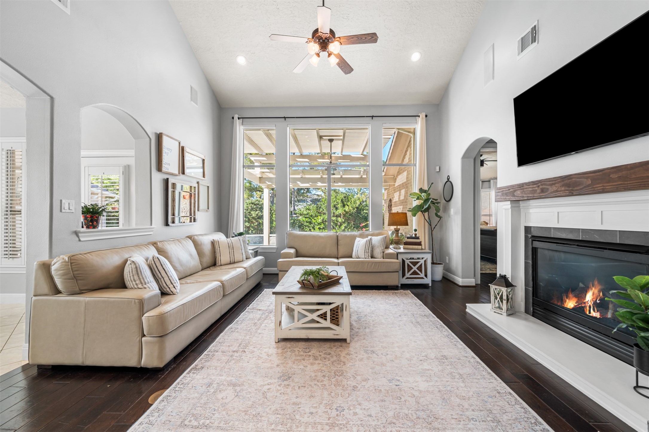 28446 Shining Creek Lane Spring, TX 77386 - Photo 12 of 47 a living room with furniture fireplace and flat screen tv