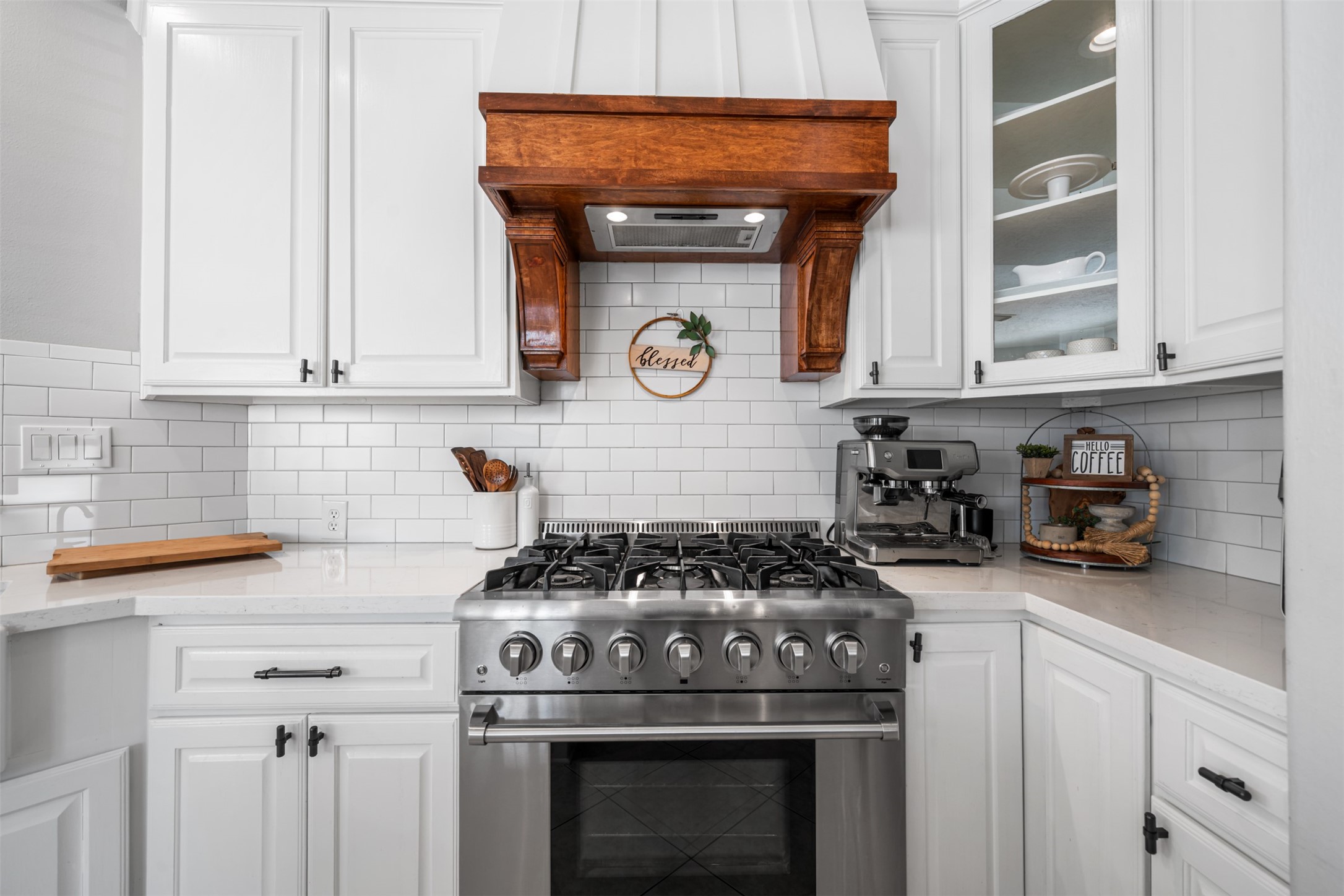 28446 Shining Creek Lane Spring, TX 77386 - Photo 16 of 47 a kitchen with stainless steel appliances a stove and white cabinets