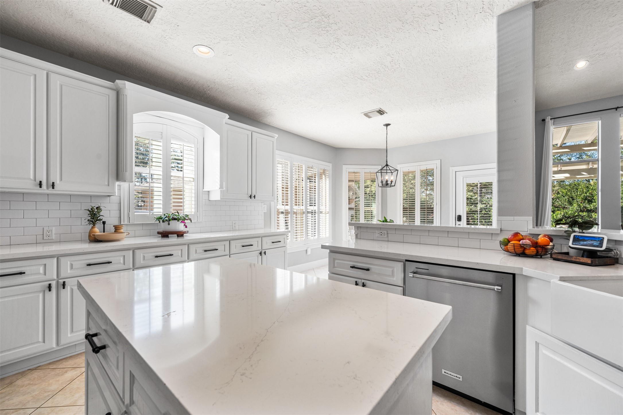 28446 Shining Creek Lane Spring, TX 77386 - Photo 17 of 47 a large white kitchen with sink and cabinets