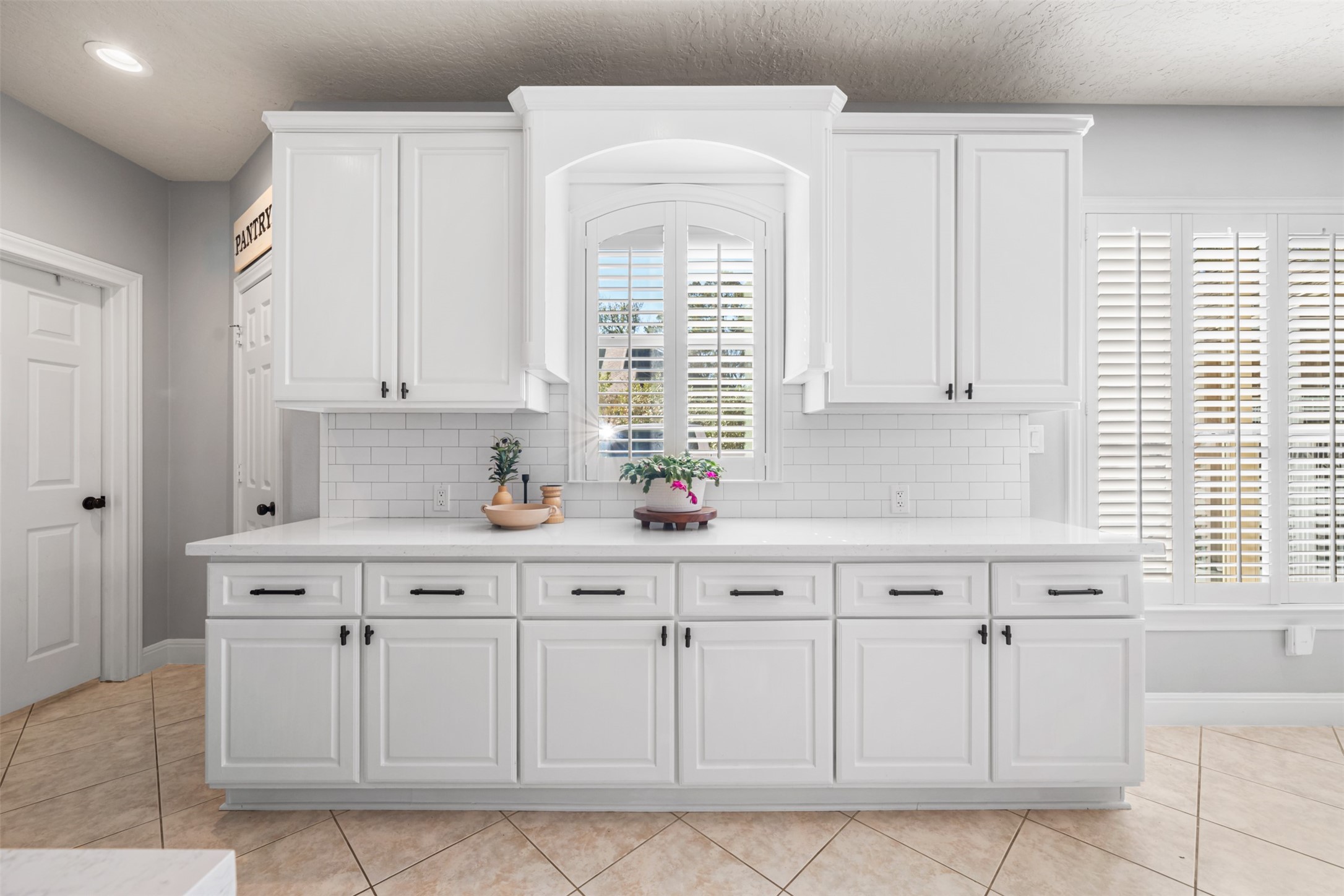 28446 Shining Creek Lane Spring, TX 77386 - Photo 20 of 47 a kitchen with white cabinets