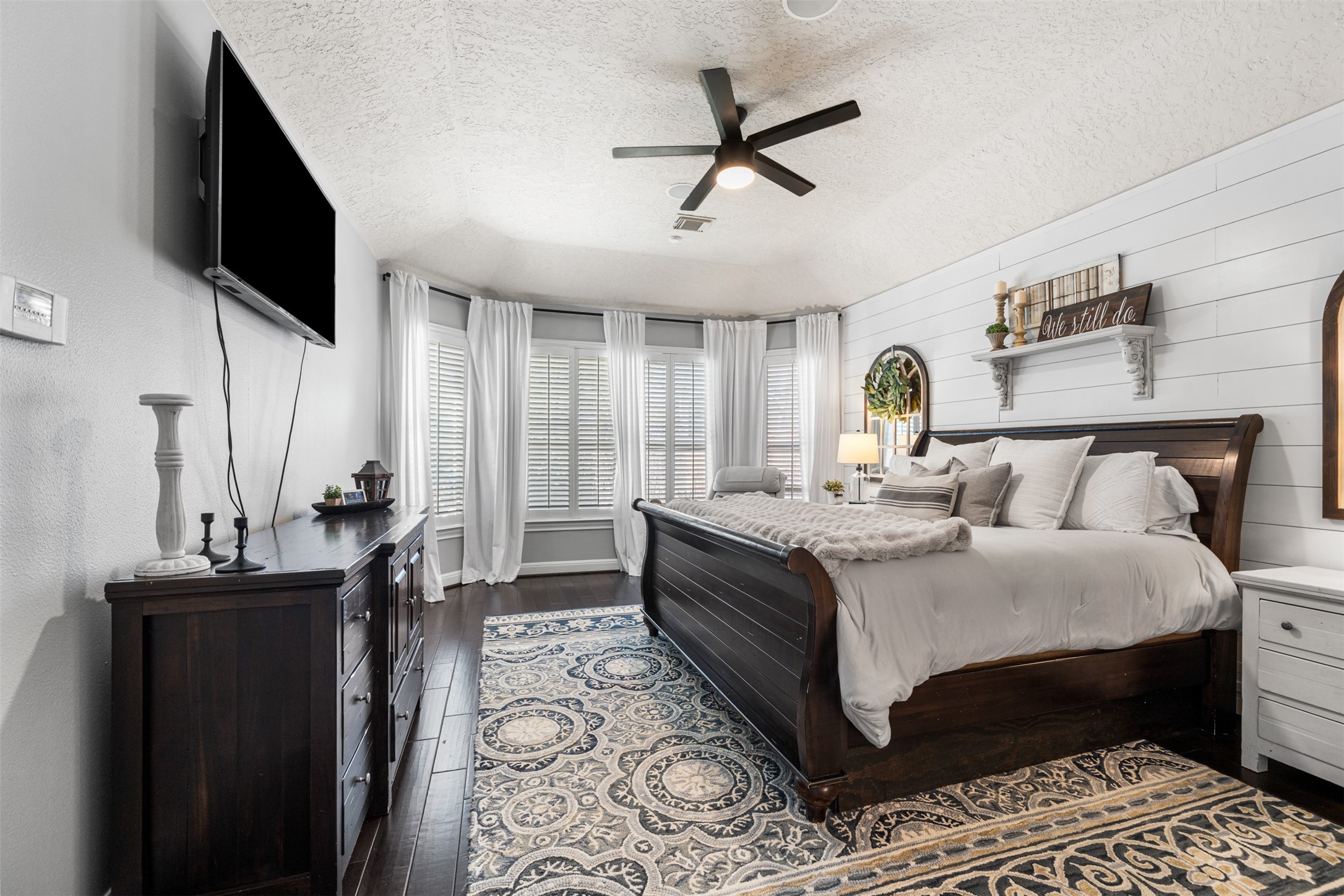 28446 Shining Creek Lane Spring, TX 77386 - Photo 21 of 47 a bedroom with a bed a flat screen tv and couches