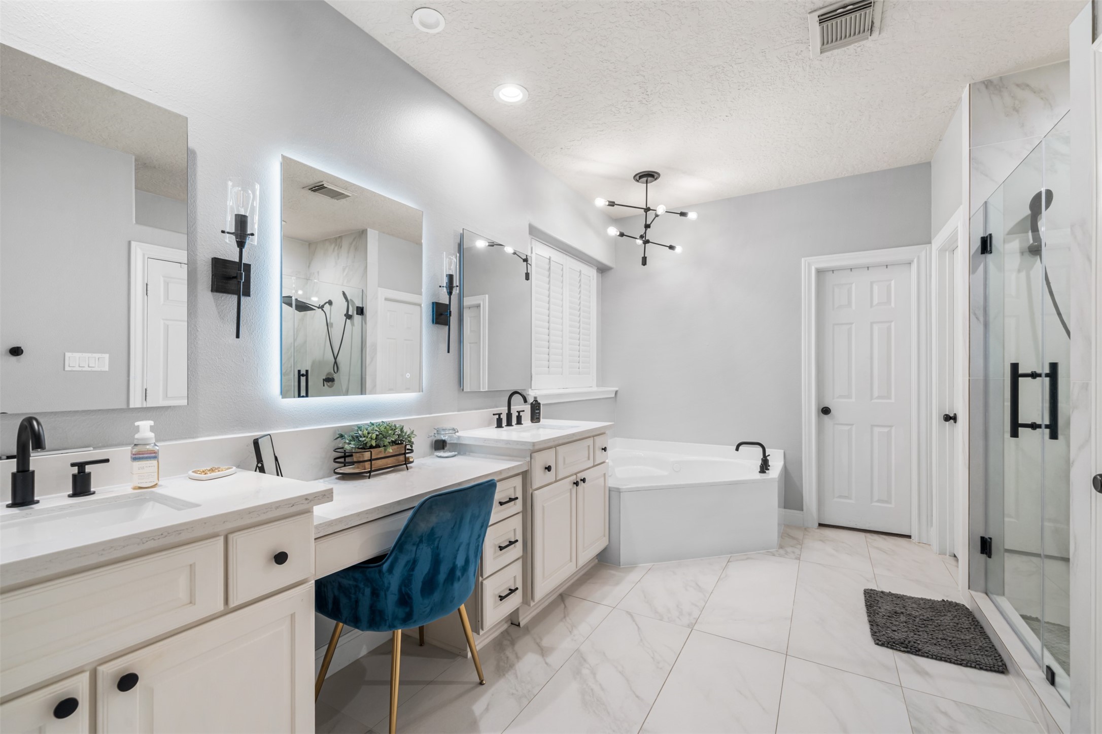 28446 Shining Creek Lane Spring, TX 77386 - Photo 23 of 47 a spacious en suite bathroom with a double vanity sink a mirror a bathtub and shower