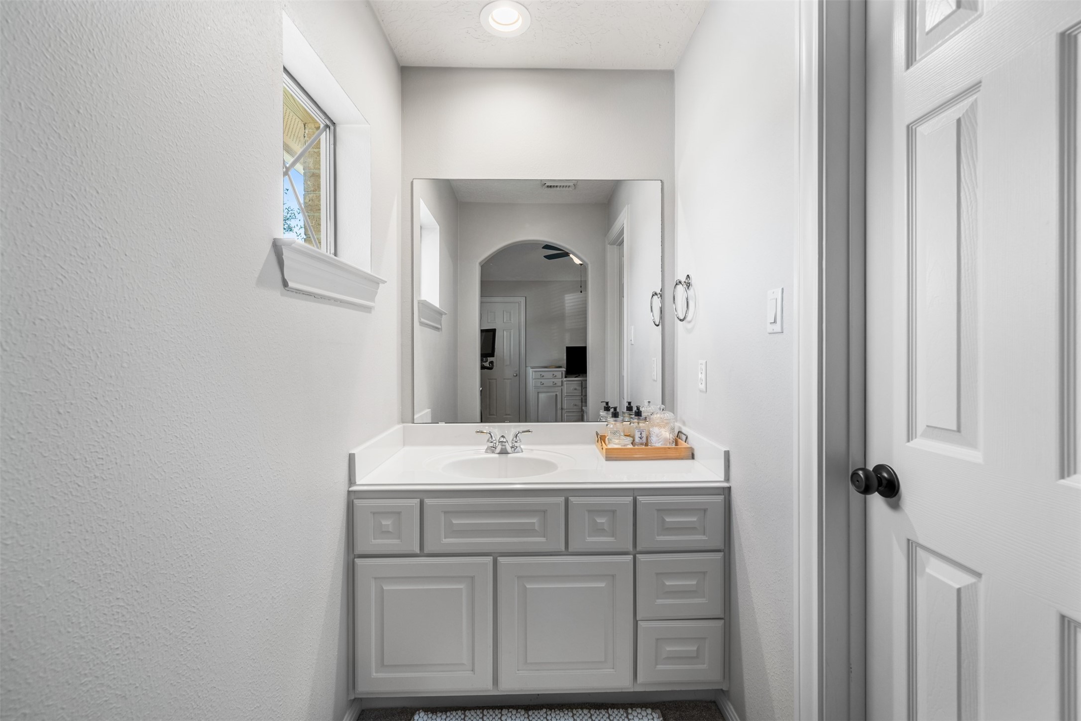 28446 Shining Creek Lane Spring, TX 77386 - Photo 36 of 47 a bathroom with a sink vanity and mirror