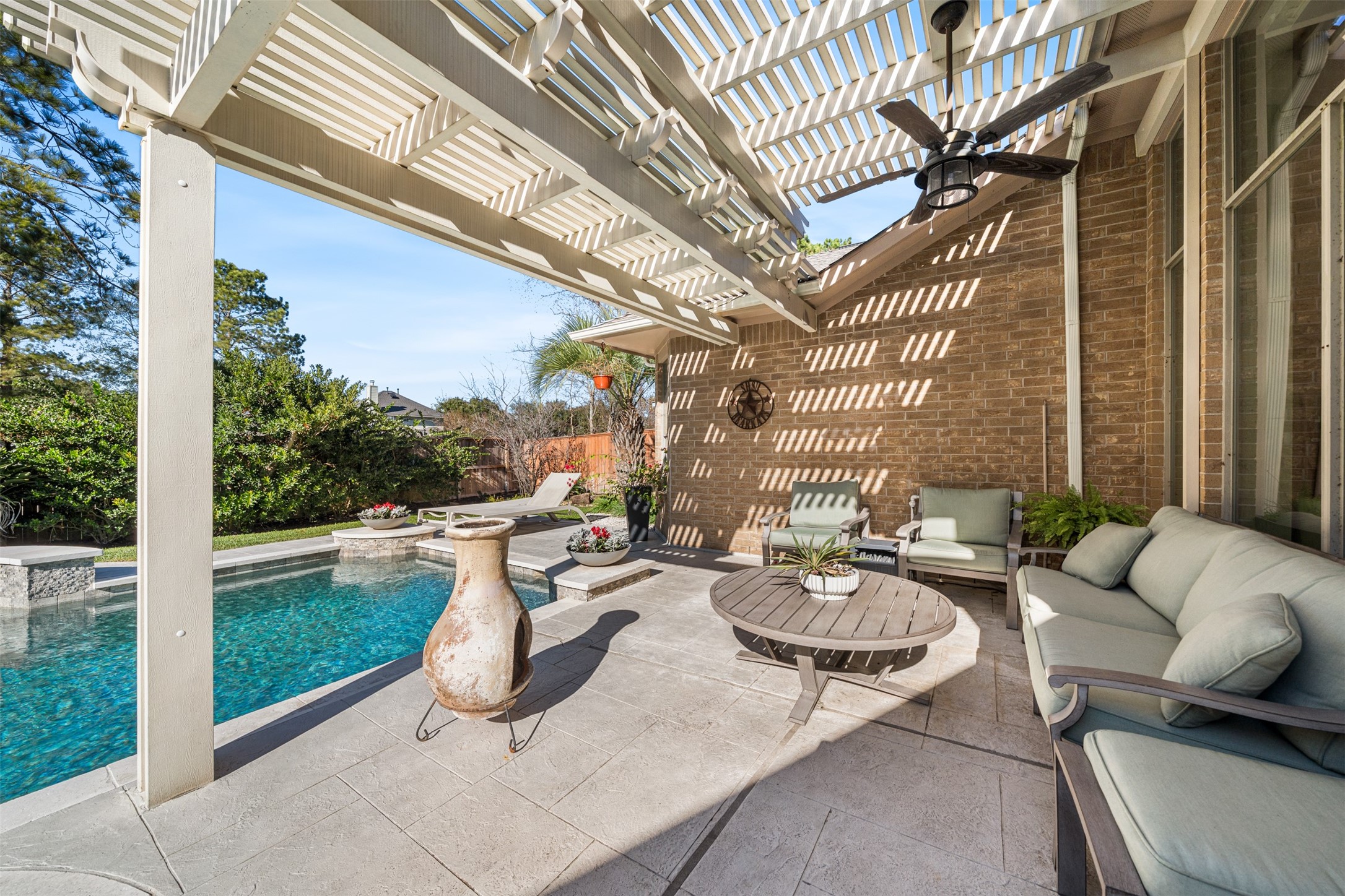 28446 Shining Creek Lane Spring, TX 77386 - Photo 43 of 47 a view of a patio with couches table and chairs and potted plants