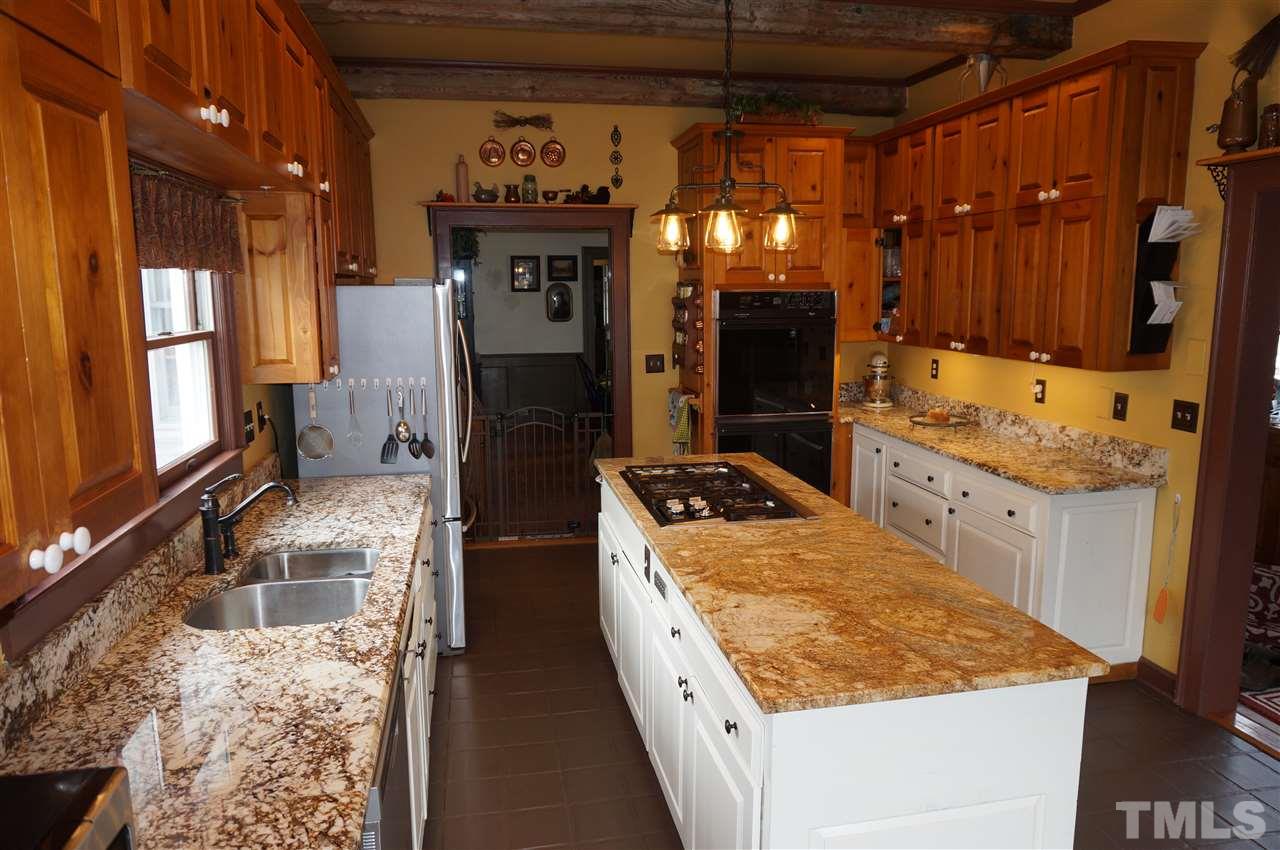 3919 Raleigh Road Clayton, NC 27520 - Photo 17 of 25 Kitchen view into dining room