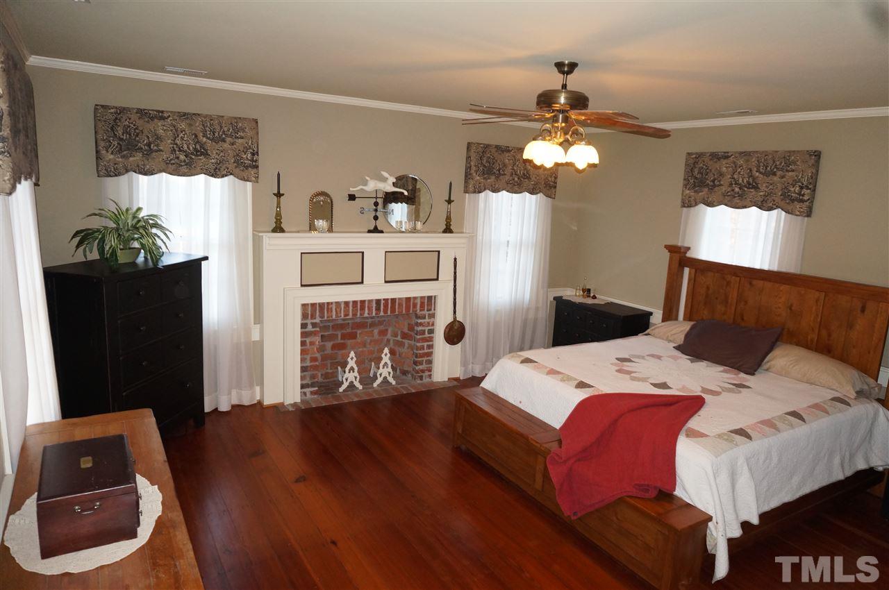 3919 Raleigh Road Clayton, NC 27520 - Photo 21 of 25 Upstairs 2nd bedroom with fireplace