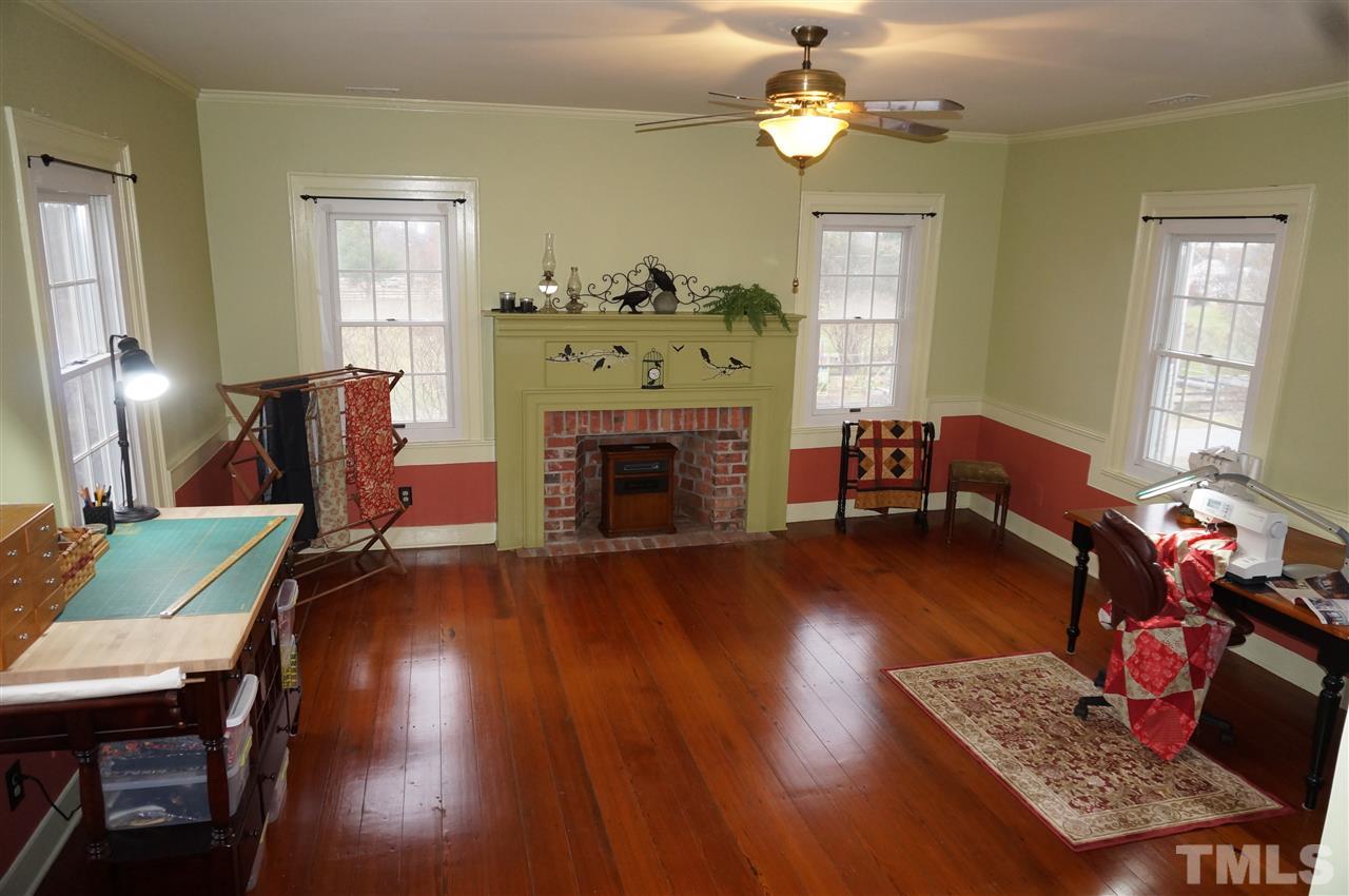 3919 Raleigh Road Clayton, NC 27520 - Photo 23 of 25 Upstairs 3rd bedroom with fireplace