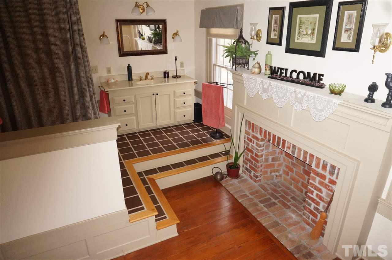 3919 Raleigh Road Clayton, NC 27520 - Photo 25 of 25 Upstairs bathroom with fireplace