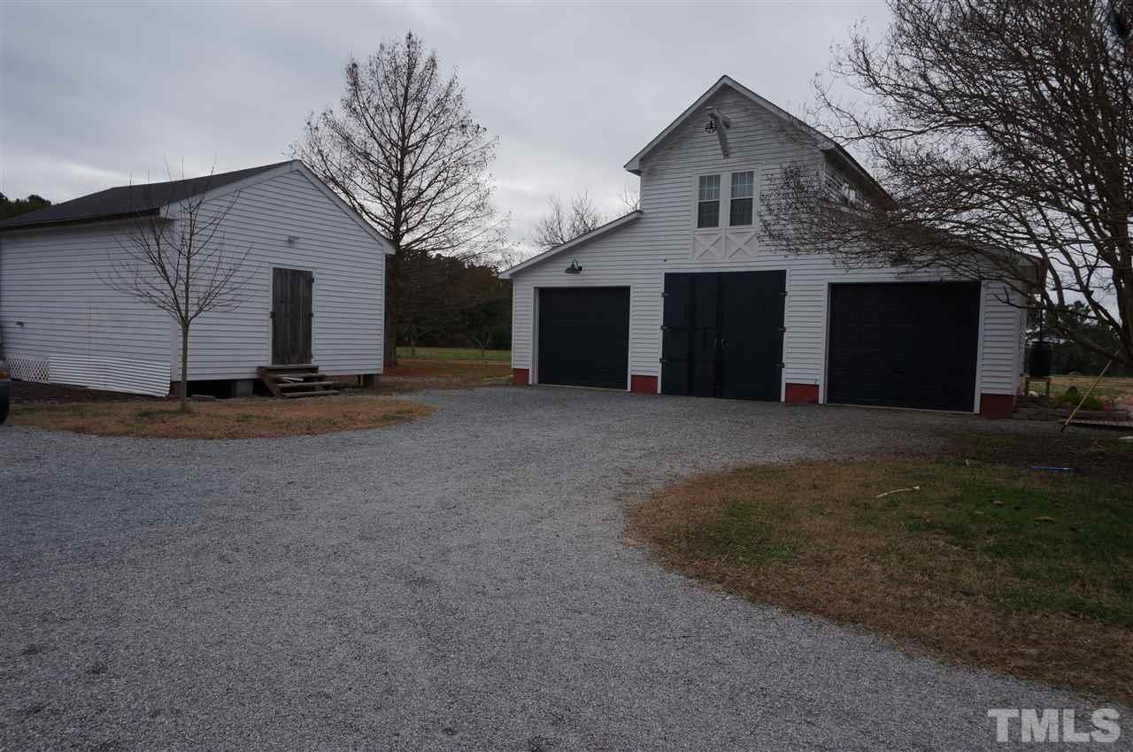 3919 Raleigh Road Clayton, NC 27520 - Photo 5 of 25 3 car garage with studio/bedroom above, storage building