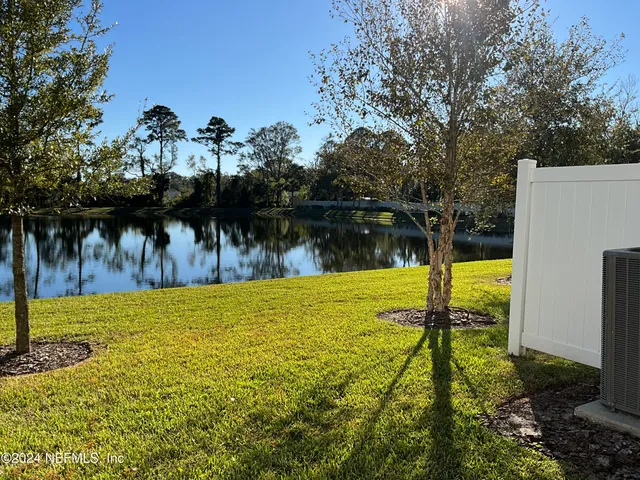 a view of a lake with a yard