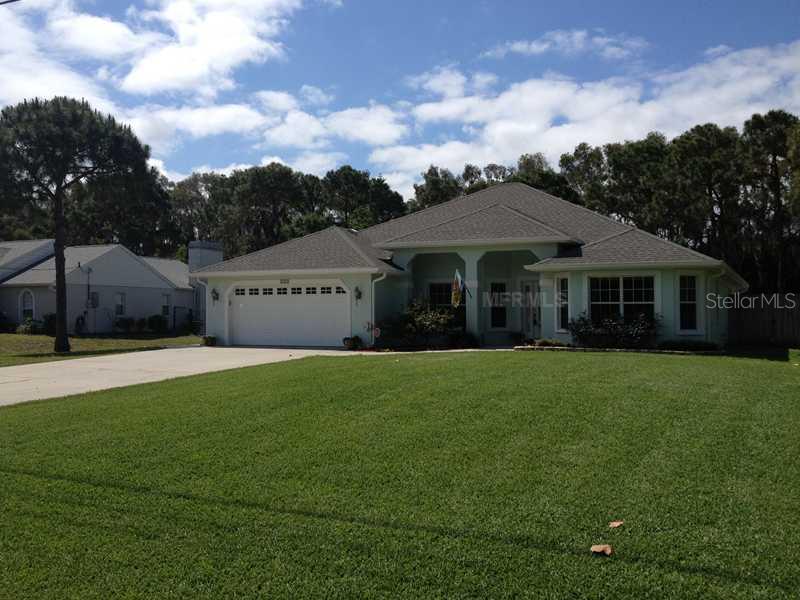 214 Burney Road Osprey, FL 34229 - Photo 1 of 1 Exterior Front - 1/2 acre site with large rear fenced yard. Note the long driveway.
