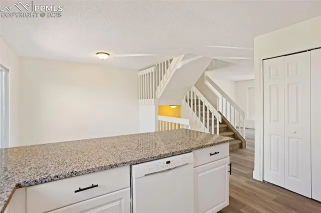 a view of entryway with wooden floor