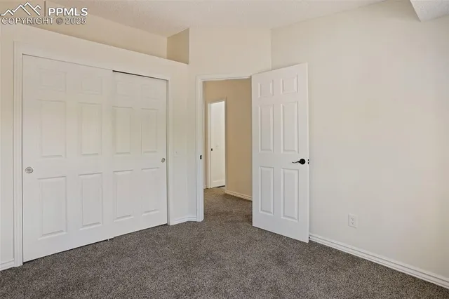 an empty room with closet area