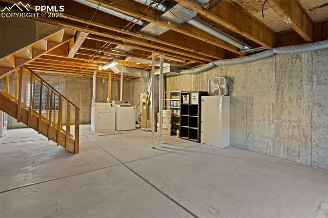 a view of an empty room with wooden walls